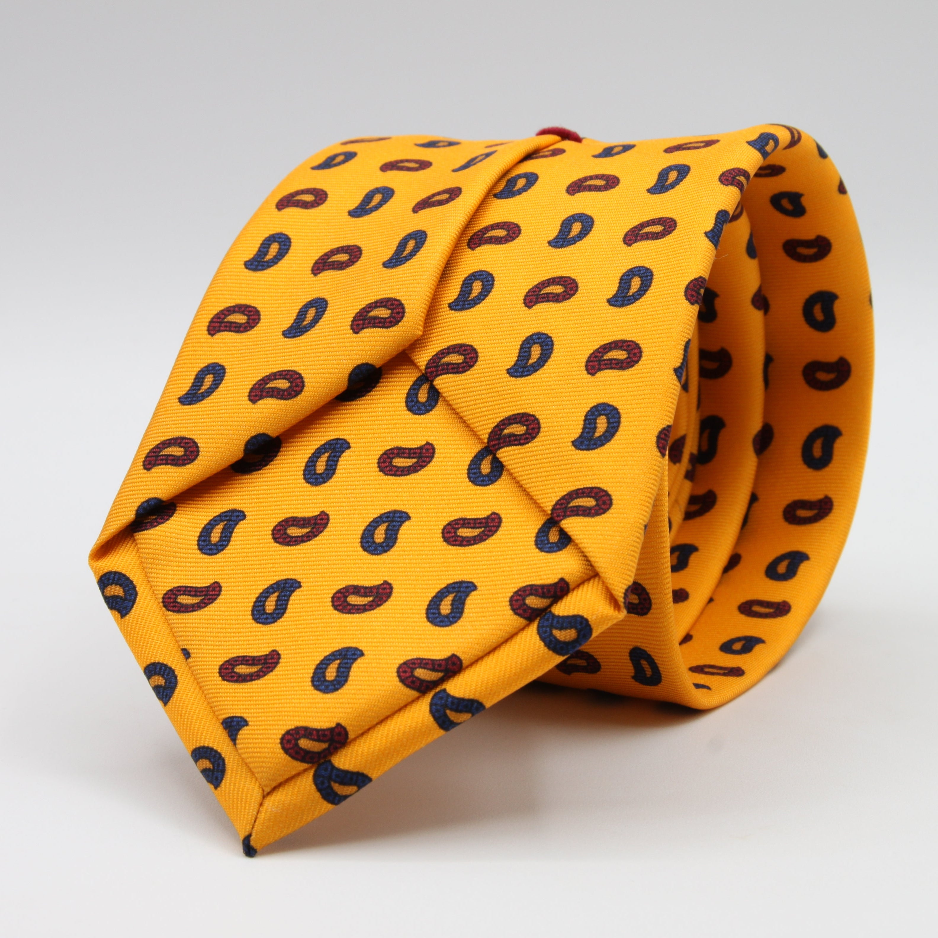 Cruciani &amp; bella&nbsp;
100% Printed Silk
Designs from the British archives
Self-Tipped
Yellow, Navy Blue and Red Motif Tie
Handmade in Italy
8 x 150 cm
#9470