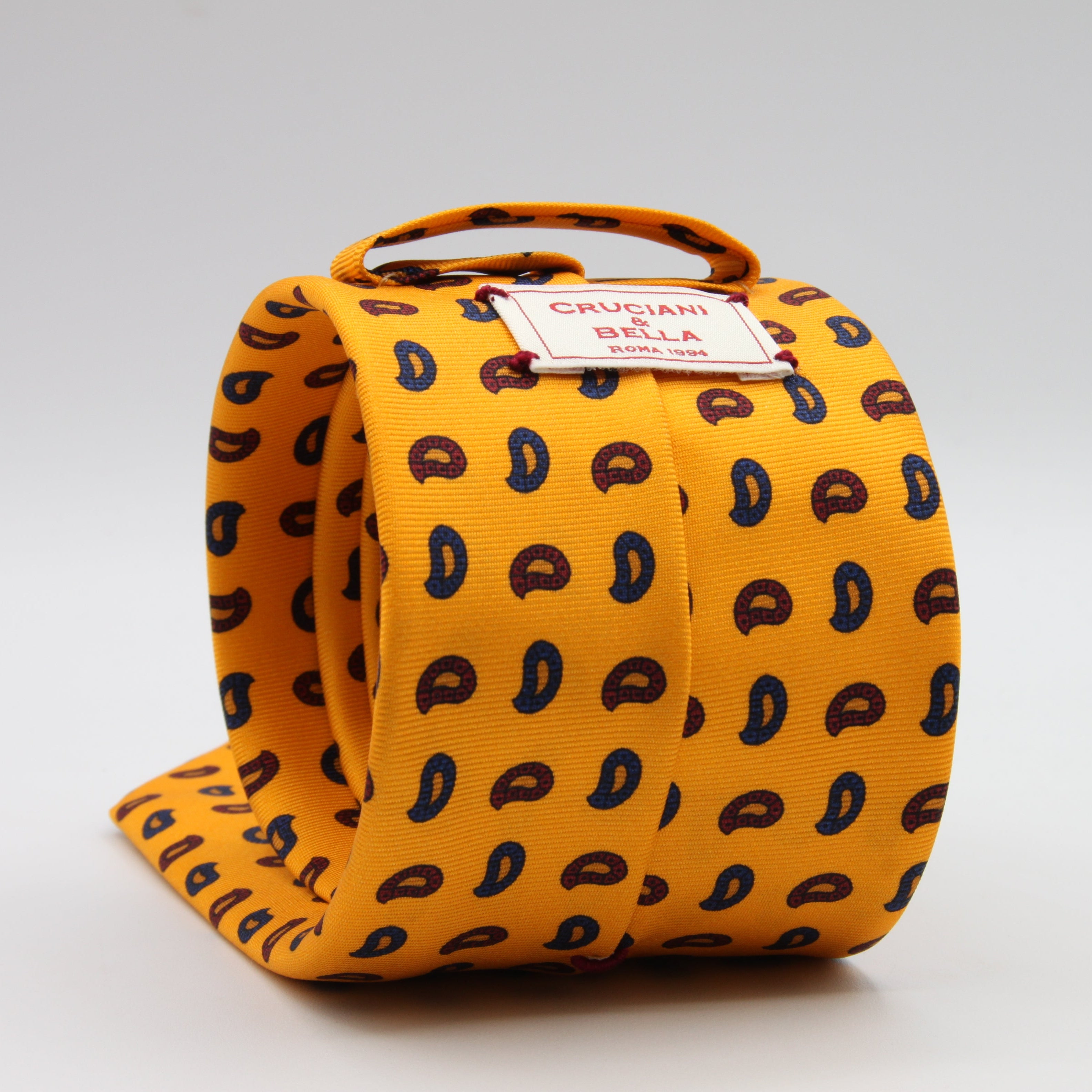 Cruciani &amp; bella&nbsp;
100% Printed Silk
Designs from the British archives
Self-Tipped
Yellow, Navy Blue and Red Motif Tie
Handmade in Italy
8 x 150 cm
#9470