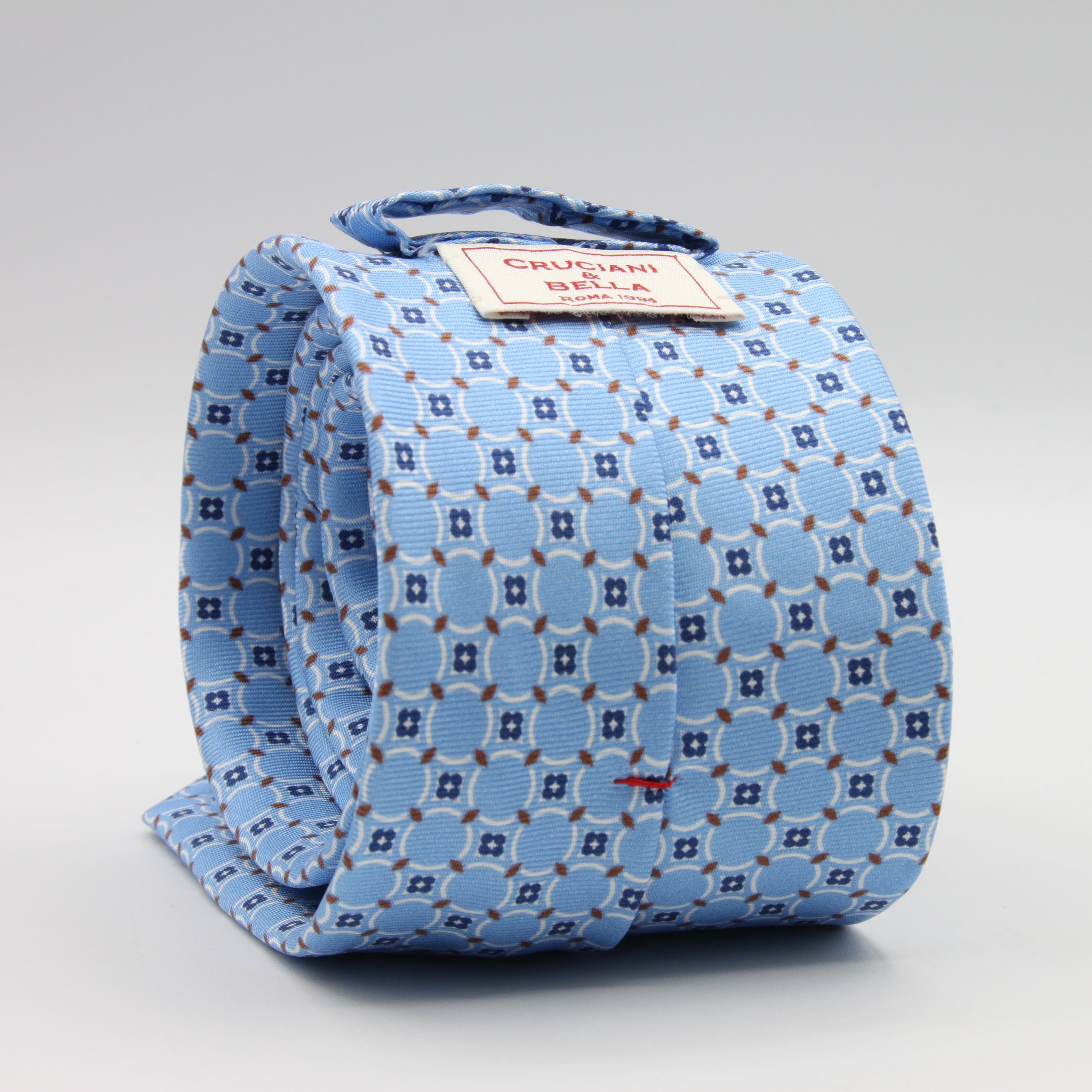 Cruciani &amp; Bella Tie
100%&nbsp; Silk
Printed and Handmade in Italy
Self-Tipped
Sky Blue, Navy Blue, White and Brown Tie

8 cm x 150 cm
#9603