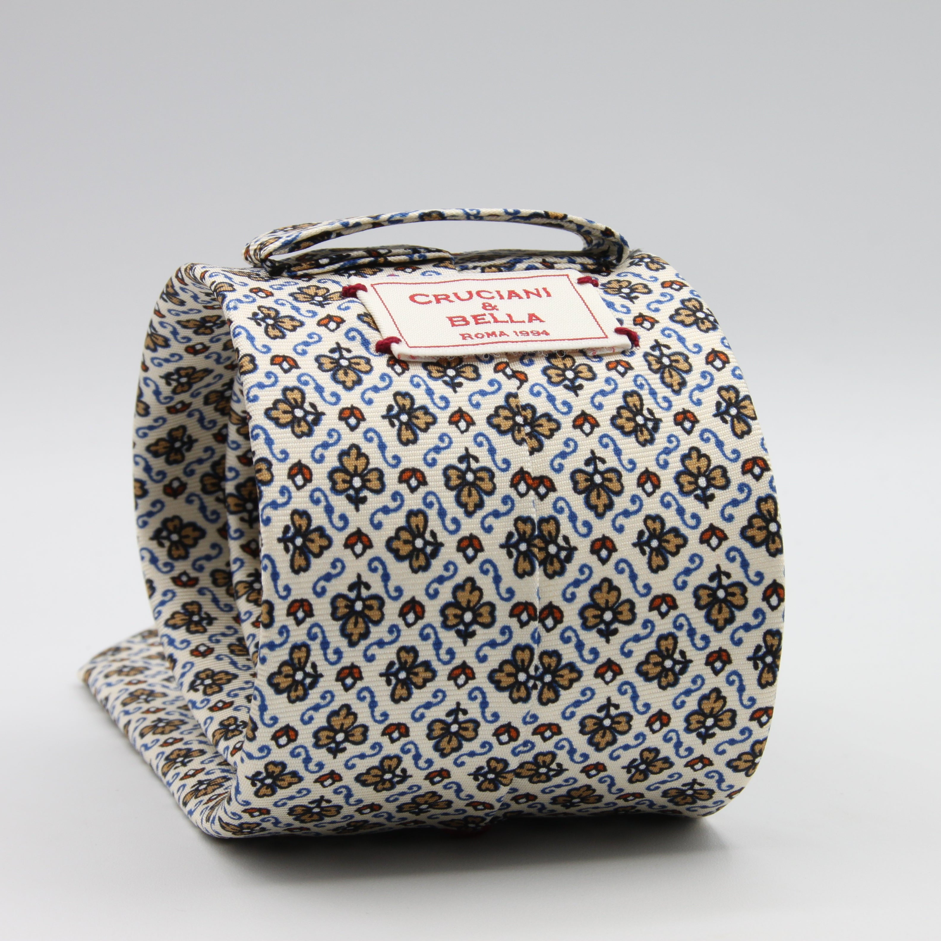 Cruciani &amp; Bella Tie
100%&nbsp; Silk
Printed and Handmade in Italy
Self-Tipped
Off-White, Cream, Rust and Sky Blue Tie

8 cm x 150 cm
#9459