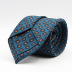 Holliday &amp; Brown for Cruciani &amp; Bella
100% Printed Wool
Self-Tipped

Torquise Blue, Blue and Orange motif Tie&nbsp;
Handmade in Italy

8 cm x 150 cm
#9595