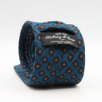 Holliday &amp; Brown for Cruciani &amp; Bella
100% Printed Wool
Self-Tipped

Torquise Blue, Blue and Orange motif Tie&nbsp;
Handmade in Italy

8 cm x 150 cm
#9595