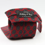 Holliday &amp; Brown for Cruciani &amp; Bella
100% Printed Wool
Self-Tipped

Red, Blue and Brown motif Tie&nbsp;
Handmade in Italy

8 cm x 150 cm
#8079
