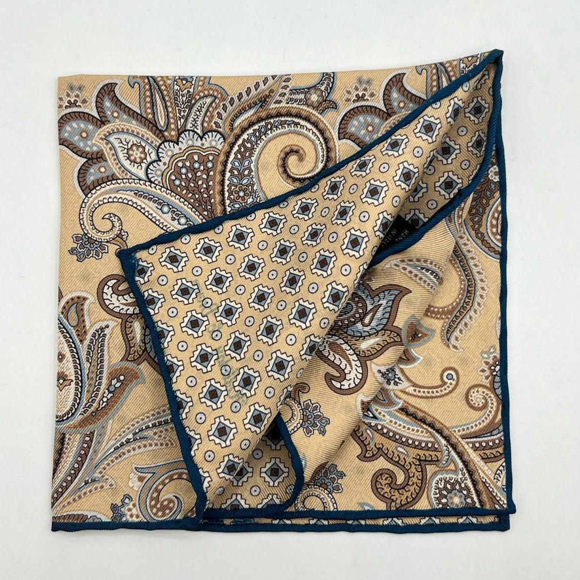 Holliday & Brown Hand-rolled   Holliday & Brown for Cruciani & Bella 100% Silk Beige, Light Brown and Blue paisley Double Faces Paisley  Motif  Pocket Square Handmade in Italy 32 cm X 32 cm