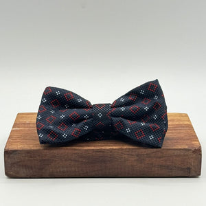 <ul> <li>Cruciani &amp; Bella Bow Tie</li> <li>100% Woven Silk Jacquard Made in England</li> <li>Handmade in Italy</li> <li>Navy Blue, Red and Light Blue motif</li> <li>Handcrafted in Italy</li> <li>Coated metal Labels</li> <li>Bow Ties</li> </ul>