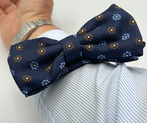 <ul> <li>Cruciani &amp; Bella Bow Tie</li> <li>100% Woven Silk Jacquard Made in England</li> <li>Handmade in Italy</li> <li>Navy Blue, Brown and Light Blue motif</li> <li>Handcrafted in Italy</li> <li>Coated metal Labels</li> <li>Bow Ties</li> </ul>