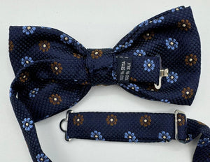 <ul> <li>Cruciani &amp; Bella Bow Tie</li> <li>100% Woven Silk Jacquard Made in England</li> <li>Handmade in Italy</li> <li>Navy Blue, Brown and Light Blue motif</li> <li>Handcrafted in Italy</li> <li>Coated metal Labels</li> <li>Bow Ties</li> </ul>