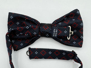 <ul> <li>Cruciani &amp; Bella Bow Tie</li> <li>100% Woven Silk Jacquard Made in England</li> <li>Handmade in Italy</li> <li>Navy Blue, Red and Light Blue motif</li> <li>Handcrafted in Italy</li> <li>Coated metal Labels</li> <li>Bow Ties</li> </ul>