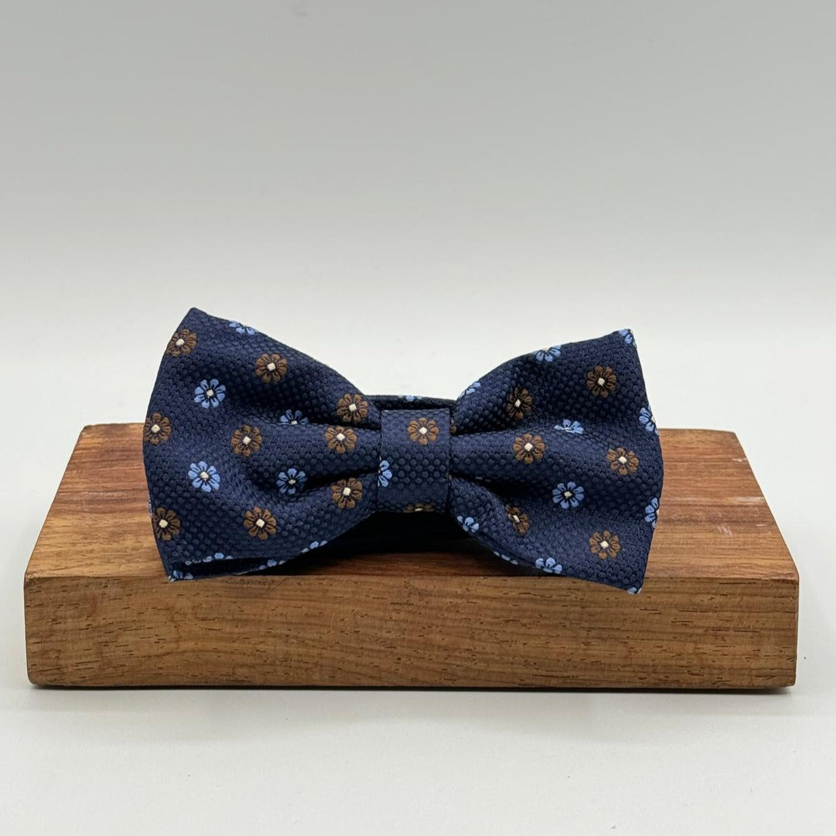 <ul> <li>Cruciani &amp; Bella Bow Tie</li> <li>100% Woven Silk Jacquard Made in England</li> <li>Handmade in Italy</li> <li>Navy Blue, Brown and Light Blue motif</li> <li>Handcrafted in Italy</li> <li>Coated metal Labels</li> <li>Bow Ties</li> </ul>