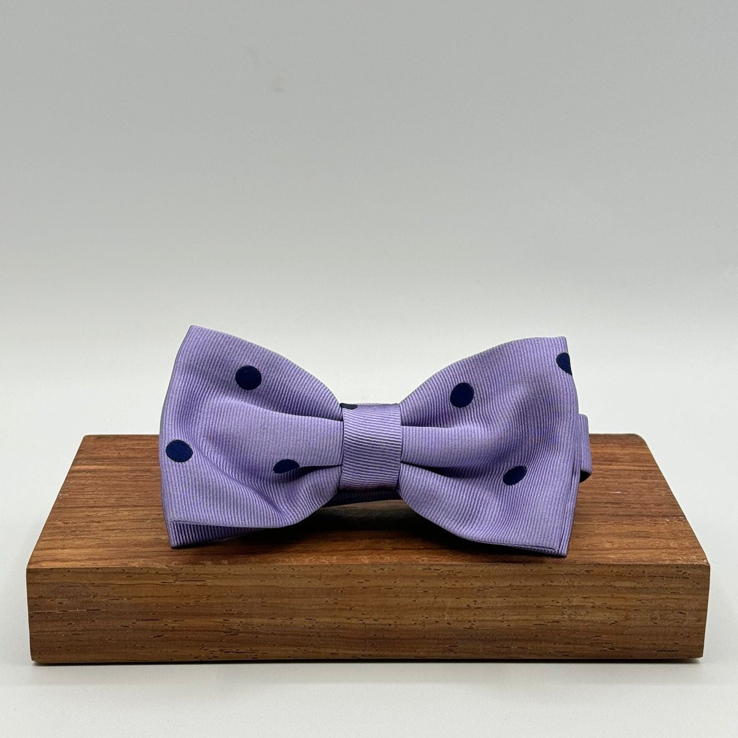 <ul> <li>Cruciani &amp; Bella Bow Tie</li> <li>100% Woven Silk Jacquard Made in England</li> <li>Handmade in Italy</li> <li>Violet, Blue Polka Dots</li> <li>Handcrafted in Italy</li> <li>Coated metal Labels</li> <li>Bow Ties</li> </ul>