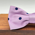 <ul> <li>Cruciani &amp; Bella Bow Tie</li> <li>100% Woven Silk Jacquard Made in England</li> <li>Handmade in Italy</li> <li>Lilac, Blue Polka Dots</li> <li>Handcrafted in Italy</li> <li>Coated metal Labels</li> <li>Bow Ties</li> </ul>