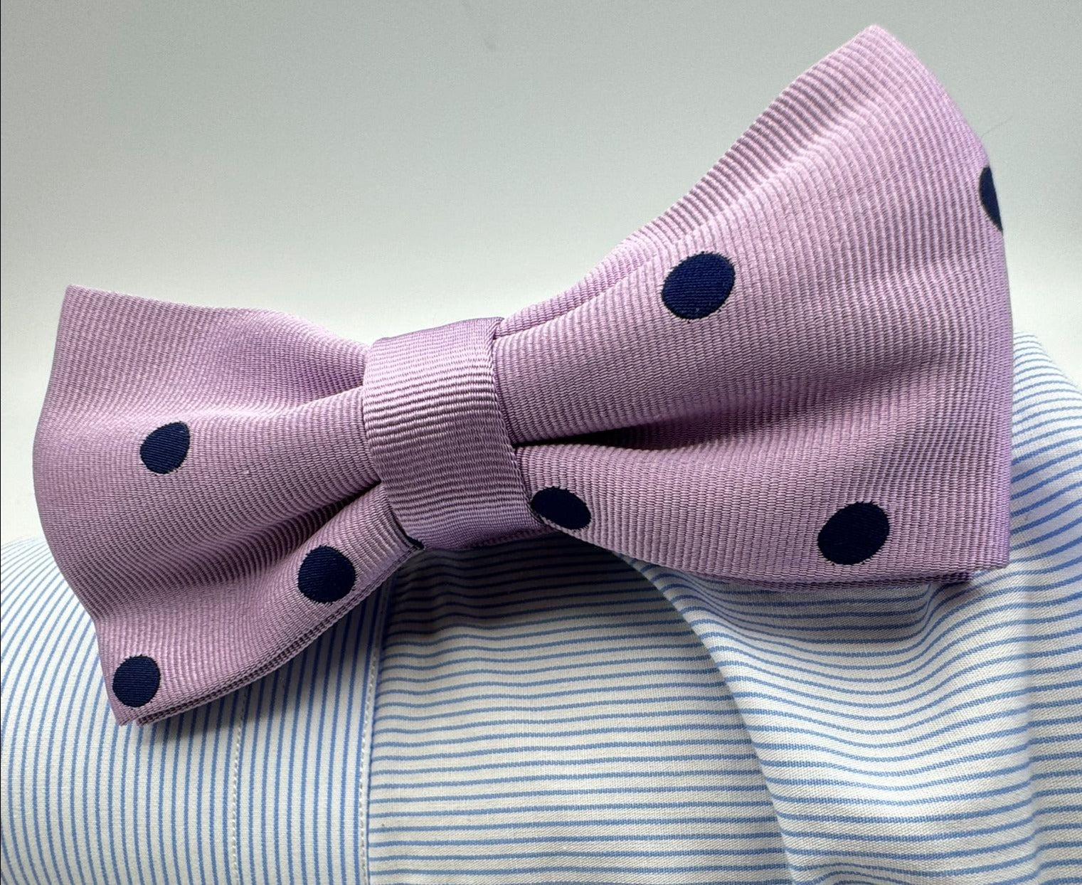 <ul> <li>Cruciani &amp; Bella Bow Tie</li> <li>100% Woven Silk Jacquard Made in England</li> <li>Handmade in Italy</li> <li>Lilac, Blue Polka Dots</li> <li>Handcrafted in Italy</li> <li>Coated metal Labels</li> <li>Bow Ties</li> </ul>