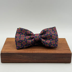 <ul> <li>Cruciani &amp; Bella Bow Tie</li> <li>100% Printed Silk Made in England</li> <li>Handmade in Italy</li> <li>Blue,Red, Orange and Light Blue motif</li> <li>Handcrafted in Italy</li> <li>Coated metal Labels</li> <li>Bow Ties</li> </ul>