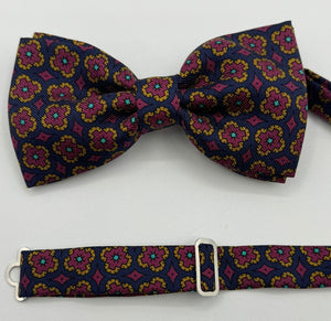 <ul> <li>Cruciani &amp; Bella Bow Tie</li> <li>100% Printed Silk Made in England</li> <li>Handmade in Italy</li> <li>Blue,Red, Orange and Light Blue motif</li> <li>Handcrafted in Italy</li> <li>Coated metal Labels</li> <li>Bow Ties</li> </ul>