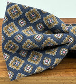 <ul> <li>Cruciani &amp; Bella Bow Tie</li> <li>100% Printed Madder Silk&nbsp;</li> <li>Handmade in Italy</li> <li>Blue,&nbsp; Brown, Light Blue and Pink motif</li> <li>Handcrafted in Italy</li> <li>Coated metal Labels</li> <li>Bow Tie</li> </ul>