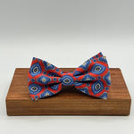 <ul> <li>Cruciani &amp; Bella Bow Tie</li> <li>100% Printed Madder Silk&nbsp;</li> <li>Handmade in Italy</li> <li>Red, Blue, Beige, Light Blue and Orange motif&nbsp;&nbsp;</li> <li>Handcrafted in Italy</li> <li>Coated metal Labels</li> <li>Bow Tie</li> </ul>