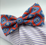 <ul> <li>Cruciani &amp; Bella Bow Tie</li> <li>100% Printed Madder Silk&nbsp;</li> <li>Handmade in Italy</li> <li>Red, Blue, Beige, Light Blue and Orange motif&nbsp;&nbsp;</li> <li>Handcrafted in Italy</li> <li>Coated metal Labels</li> <li>Bow Tie</li> </ul>