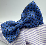 <ul> <li>Cruciani &amp; Bella Bow Tie</li> <li>100% Printed Madder Silk&nbsp;</li> <li>Handmade in Italy</li> <li>Olimpic Blue, Blue, Brown and Off White motif&nbsp;&nbsp;</li> <li>Handcrafted in Italy</li> <li>Coated metal Labels</li> <li>Bow Tie</li> </ul>