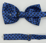 <ul> <li>Cruciani &amp; Bella Bow Tie</li> <li>100% Printed Madder Silk&nbsp;</li> <li>Handmade in Italy</li> <li>Olimpic Blue, Blue, Brown and Off White motif&nbsp;&nbsp;</li> <li>Handcrafted in Italy</li> <li>Coated metal Labels</li> <li>Bow Tie</li> </ul>