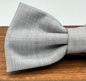 <ul> <li>Cruciani &amp; Bella Bow Tie</li> <li>100% Wool Holland &amp; Sherry</li> <li>Handmade in Italy</li> <li>Light Grey Plain</li> <li>Handcrafted in Italy</li> <li>Coated metal Labels</li> <li>Bow Ties</li> </ul>