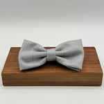 <ul> <li>Cruciani &amp; Bella Bow Tie</li> <li>100% Wool Holland &amp; Sherry</li> <li>Handmade in Italy</li> <li>Light Grey Plain</li> <li>Handcrafted in Italy</li> <li>Coated metal Labels</li> <li>Bow Ties</li> </ul>