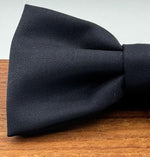 <ul> <li>Cruciani &amp; Bella Bow Tie</li> <li>100% Wool Holland &amp; Sherry</li> <li>Handmade in Italy</li> <li>Dark Blue Plain</li> <li>Handcrafted in Italy</li> <li>Coated metal Labels</li> <li>Bow Ties</li> </ul>