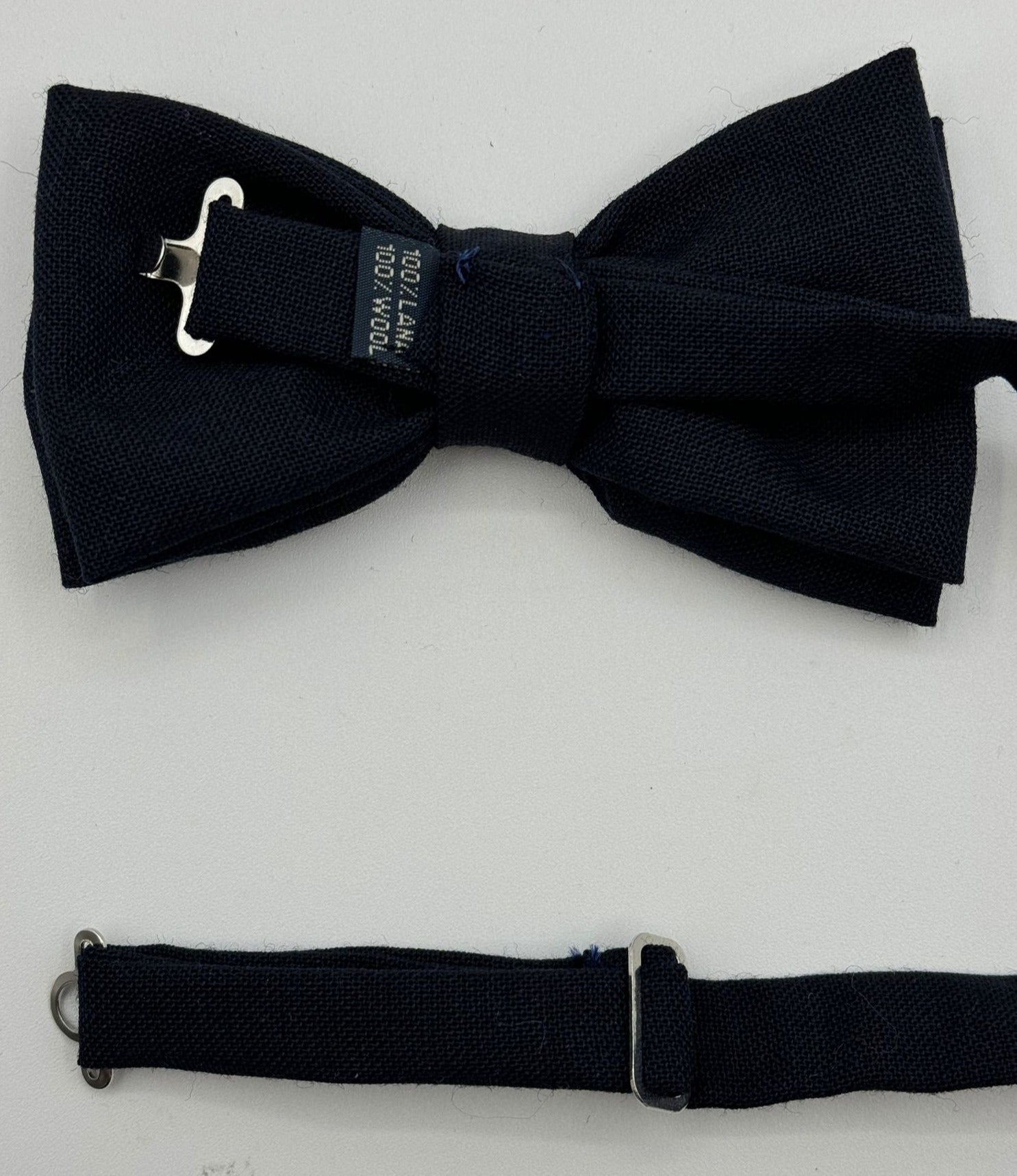 <ul> <li>Cruciani &amp; Bella Bow Tie</li> <li>100% Wool Hardy Minnis</li> <li>Handmade in Italy</li> <li>Dark Blue Plain</li> <li>Handcrafted in Italy</li> <li>Coated metal Labels</li> <li>Bow Ties</li> </ul>