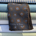 Holliday &amp; Brown
Hand-rolled&nbsp;&nbsp;
Holliday &amp; Brown for Cruciani &amp; Bella
100% Silk
Navy Blue, Brown and Light Blue
Double Faces
Motif&nbsp; Pocket Square
Handmade in Italy

32 cm X 32 cm