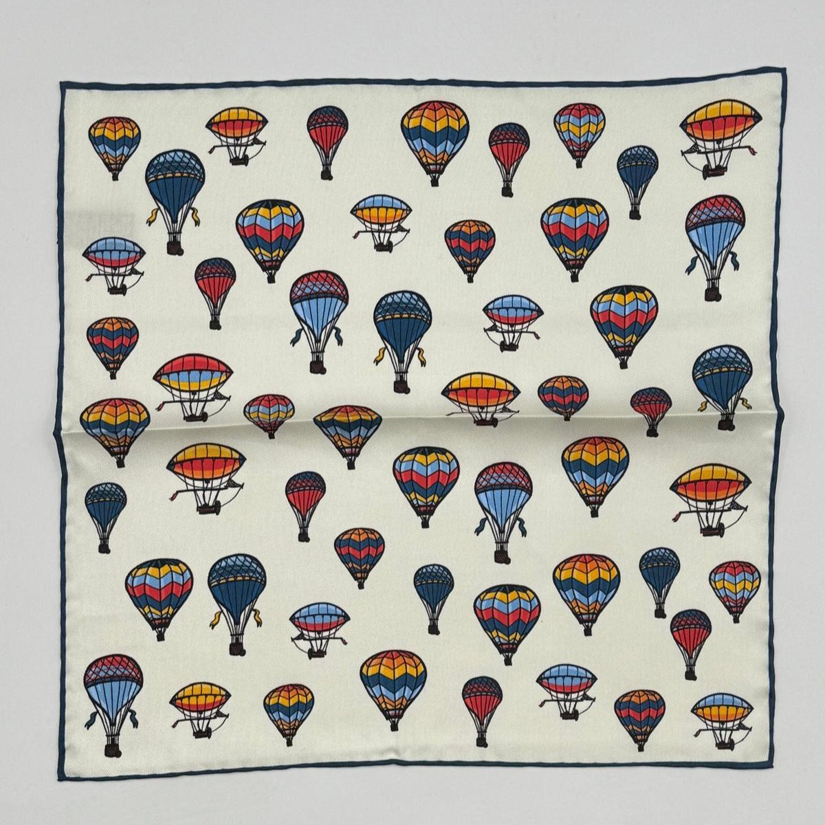 Cruciani &amp; Bella
Hand-rolled&nbsp;&nbsp;
100% Silk
White, Red, Yellow and Light Blue

Balloon Motif Pocket Square
Made in Italy
33 cm X 33 cm