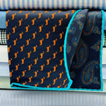 Cruciani &amp; Bella
Hand-rolled&nbsp;&nbsp;

100% Wool
Blue, Brick, Turquoise
Double Faces
Basset Hound and Paisley Motif&nbsp; Pocket Square
Handmade in Italy

33 cm X 33 cm