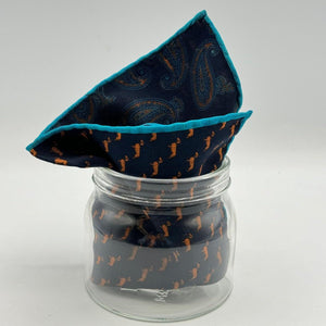 Cruciani &amp; Bella
Hand-rolled&nbsp;&nbsp;

100% Wool
Blue, Brick, Turquoise
Double Faces
Basset Hound and Paisley Motif&nbsp; Pocket Square
Handmade in Italy

33 cm X 33 cm