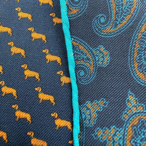 Cruciani &amp; Bella
Hand-rolled&nbsp;&nbsp;

100% Wool
Blue, Brick, Turquoise
Double Faces
Basset Hound and Paisley Motif&nbsp; Pocket Square
Handmade in Italy

33 cm X 33 cm