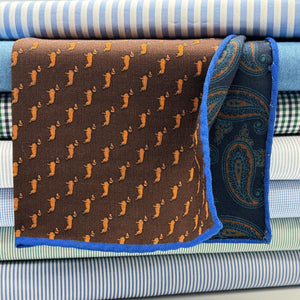 Cruciani &amp; Bella
Hand-rolled&nbsp;&nbsp;

100% Wool
Brown, Brick, Olimpic Blue
Double Faces
Basset Hound and Paisley Motif&nbsp; Pocket Square
Handmade in Italy

33 cm X 33 cm