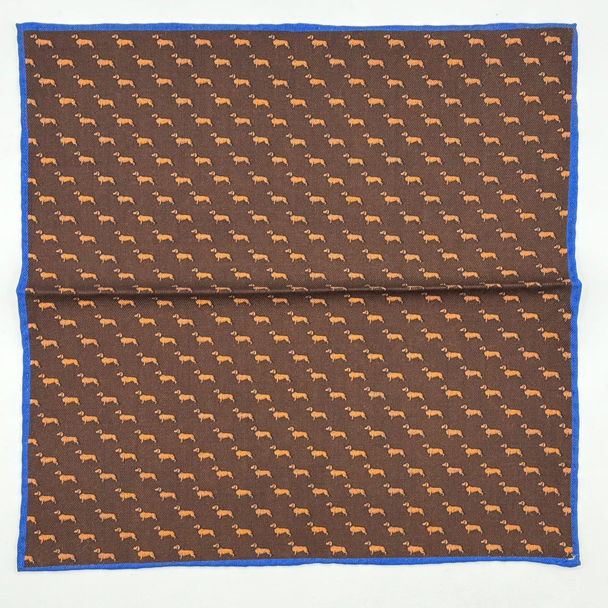 Cruciani &amp; Bella
Hand-rolled&nbsp;&nbsp;

100% Wool
Brown, Brick, Olimpic Blue
Double Faces
Basset Hound and Paisley Motif&nbsp; Pocket Square
Handmade in Italy

33 cm X 33 cm