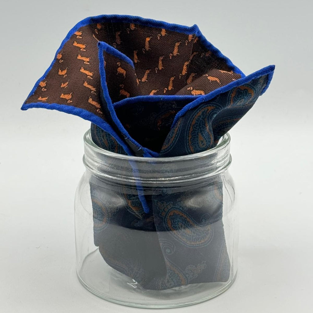 Cruciani &amp; Bella
Hand-rolled&nbsp;&nbsp;

100% Wool
Brown, Brick, Olimpic Blue
Double Faces
Basset Hound and Paisley Motif&nbsp; Pocket Square
Handmade in Italy

33 cm X 33 cm