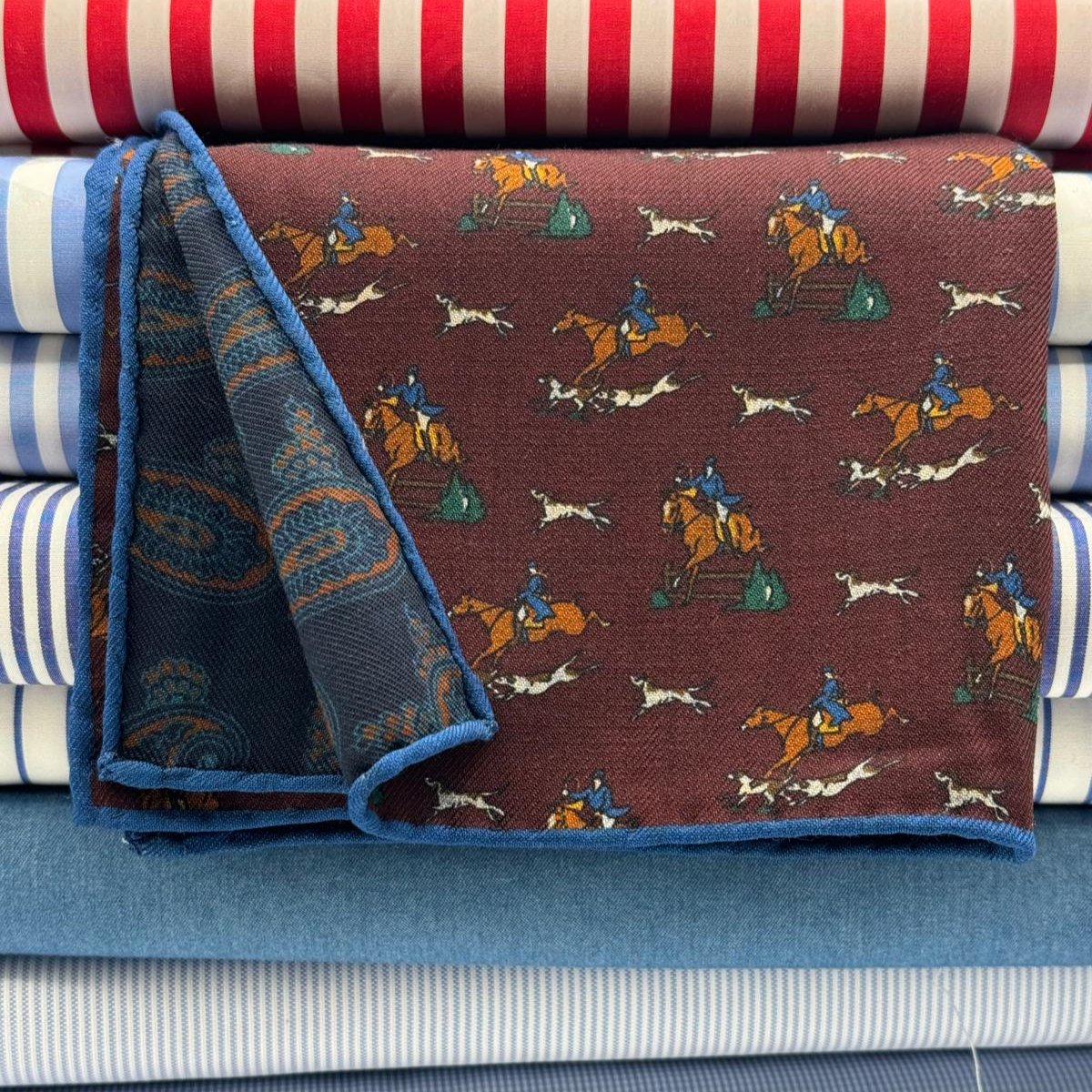 Cruciani &amp; Bella
Hand-rolled&nbsp;&nbsp;

100% Wool
Red Wine, Brown, Blue, Green and White
Double Faces
Horses and Paisley Motif&nbsp; Pocket Square
Handmade in Italy

33 cm X 33 cm
