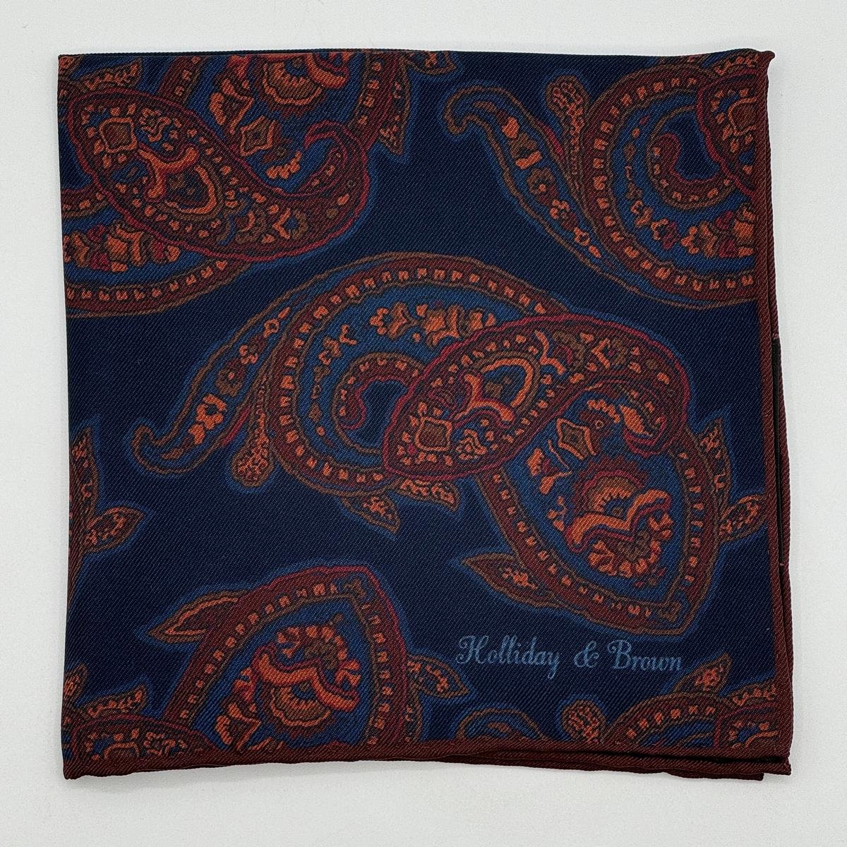 Holliday &amp; Brown for Cruciani &amp; Bella
Hand-rolled&nbsp;&nbsp;

100% Silk
Blue, Rust, Brown, Olimpic Blue,&nbsp;
Double Faces
Motif&nbsp; Pocket Square
Handmade in Italy

32 cm X 32 cm