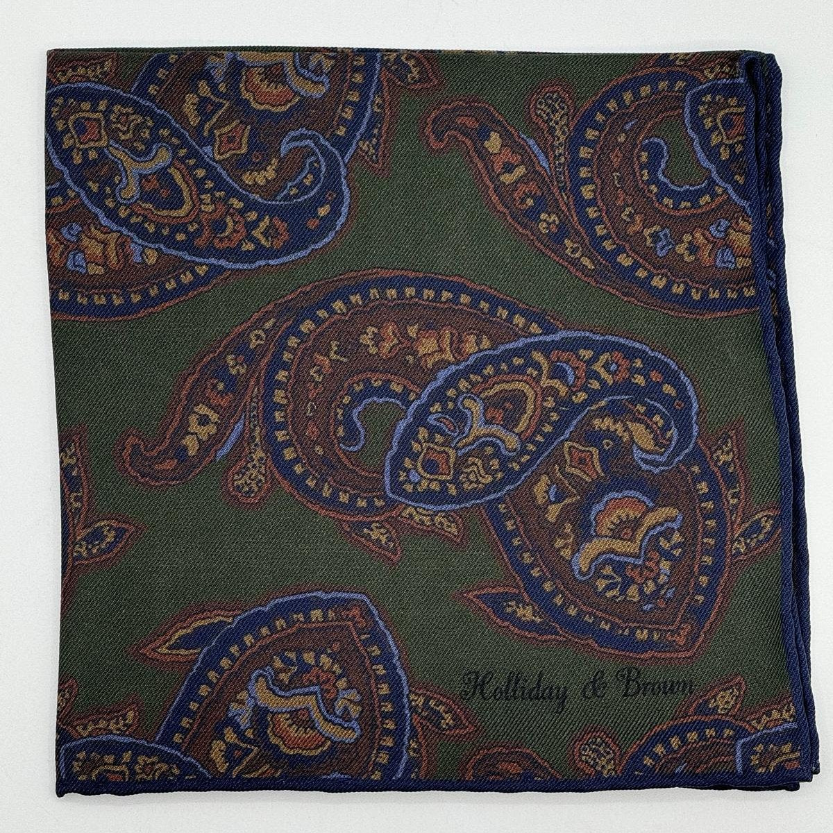 Holliday &amp; Brown for Cruciani &amp; Bella
Hand-rolled&nbsp;&nbsp;

100% Silk
Green, Brown, Blue&nbsp;
Double Faces
Motif&nbsp; Pocket Square
Handmade in Italy

32 cm X 32 cm