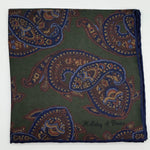 Holliday &amp; Brown for Cruciani &amp; Bella
Hand-rolled&nbsp;&nbsp;

100% Silk
Green, Brown, Blue&nbsp;
Double Faces
Motif&nbsp; Pocket Square
Handmade in Italy

32 cm X 32 cm