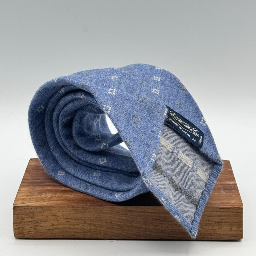 Cruciani &amp; Bella Old Label
80% Wool 20% Cashmere
Unlined
Light Blue, White and Light Grey motif Tie

Handmade in Italy
9 cm x 148 cm
New Old Stock