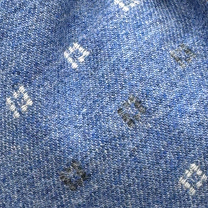 Cruciani &amp; Bella Old Label
80% Wool 20% Cashmere
Unlined
Light Blue, White and Light Grey motif Tie

Handmade in Italy
9 cm x 148 cm
New Old Stock