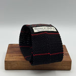 Cruciani &amp; Bella
100% Silk
Knitted Tie

Black, Red Stripe
Handmade in Italy
7,5 cm x 147 cm
New Old Stock