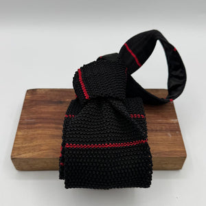 Cruciani &amp; Bella
100% Silk
Knitted Tie

Black, Red Stripe
Handmade in Italy
7,5 cm x 147 cm
New Old Stock