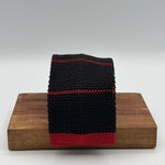 Cruciani &amp; Bella
100% Silk
Knitted Tie

Black, Red Stripe
Handmade in Italy
7,5 cm x 147 cm
New Old Stock