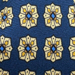 Cruciani &amp; Bella
100% Printed Silk&nbsp;
Tipped
Blue, Beige, Yellow and Light Blue Motif Tie
Handmade in Italy
8,5 cm x 148 cm
New Old Stock
