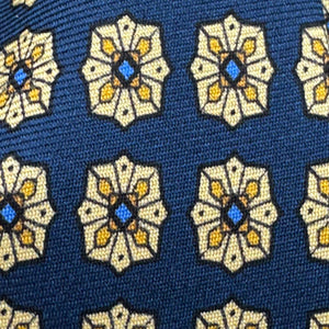 Cruciani &amp; Bella
100% Printed Silk&nbsp;
Tipped
Blue, Beige, Yellow and Light Blue Motif Tie
Handmade in Italy
8,5 cm x 148 cm
New Old Stock