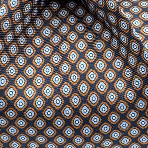 Cruciani &amp; Bella
100% Printed Silk&nbsp;
Tipped
Dark Blue, Brown, Light Blue and White Motif Tie
Handmade in Italy
8,5 cm x 148 cm
New Old Stock