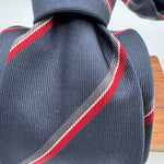 Cruciani &amp; Bella
100% Woven Silk&nbsp;

Crazy Regimental Tie
Tipped&nbsp;
Blue, Grey, Red and White Stripes

Handmade in Italy
8,5 cm x 148 cm
New Old Stock