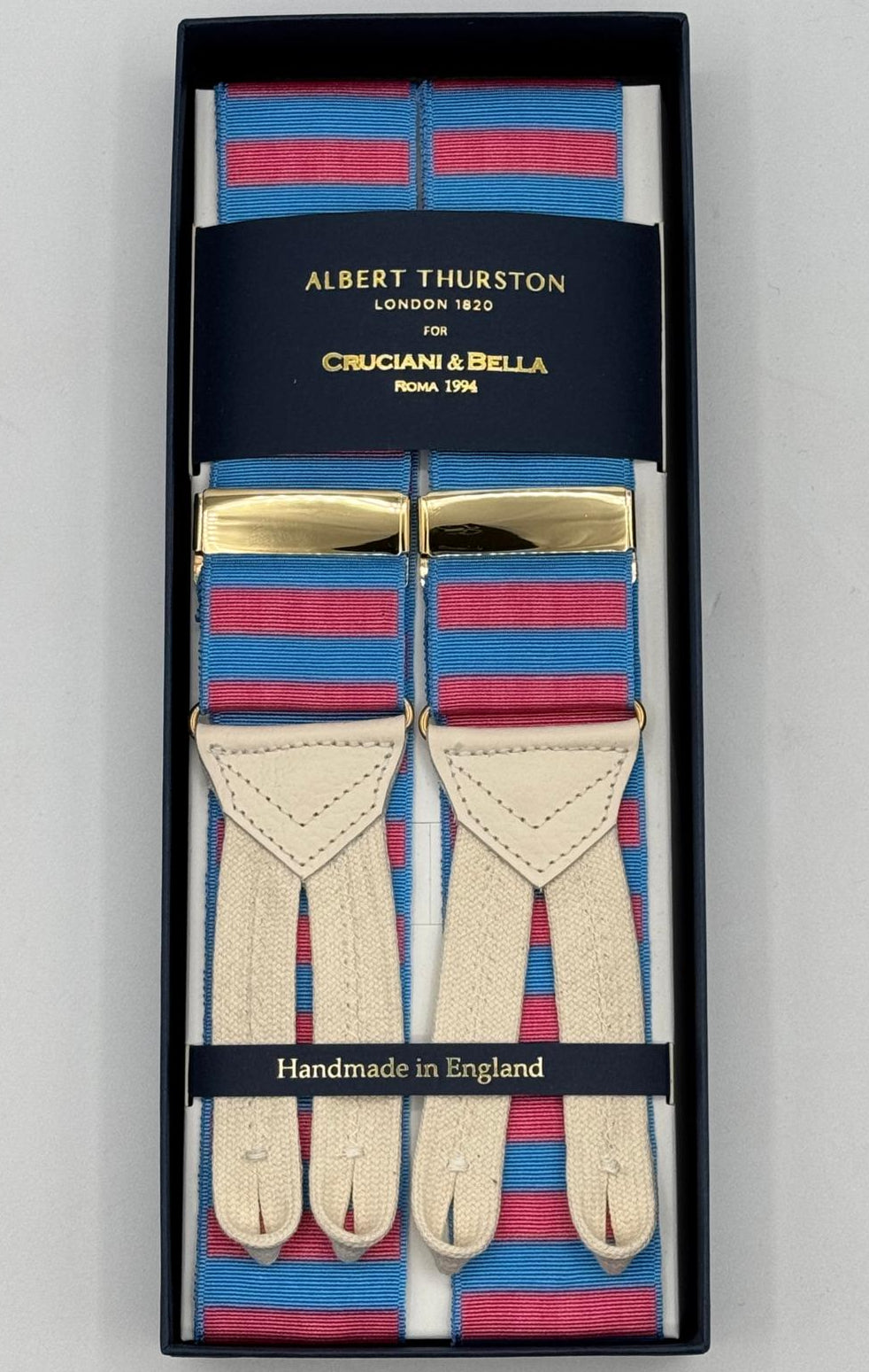 Albert Thurston for Cruciani &amp; Bella
Made in England
Adjustable Sizing
40 mm Woven Barathea&nbsp;
Pink and Azure horizontal Stripes Braces
Braid ends
Y-Shaped
Gold Fittings
Size Multifit Adjustable&nbsp;Length:&nbsp;115cm (= 45 inch) Maximum