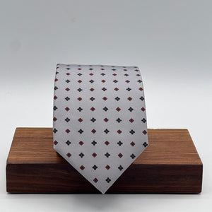 Cruciani &amp; Bella
100% Printed Silk&nbsp;
Tipped
Grey, Red and Blue Motif Tie
Handmade in Italy
8 cm x 148 cm
New Old Stock
